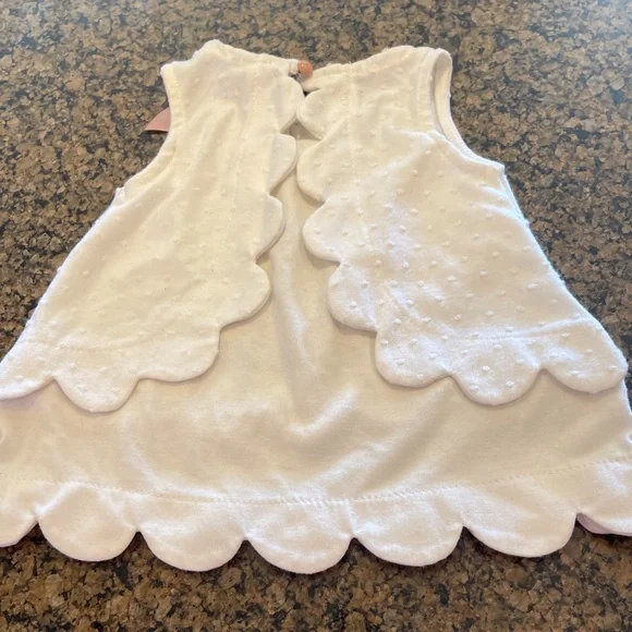 Sleeveless white top with scallops and pink bow - Picture 4 of 7